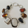 Vintage Armband aus gealtertem Silber 925 mit eingelegten Edelsteinen.