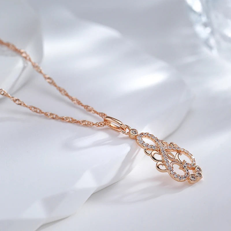 Unendliche Halskette mit Zirkonen im Ethnostil, 18 Karat Roségoldauflage