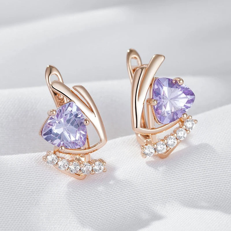 Ohrstecker mit glänzendem violettem natürlichem Zirkon und kleinem weißem Zirkon in 18K Roségoldplattierung