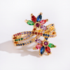 Verstellbarer Ring mit Blumenmotiv und Zirkoniasteinen, 18 Karat vergoldet